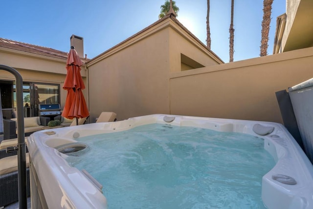 view of patio / terrace featuring a hot tub