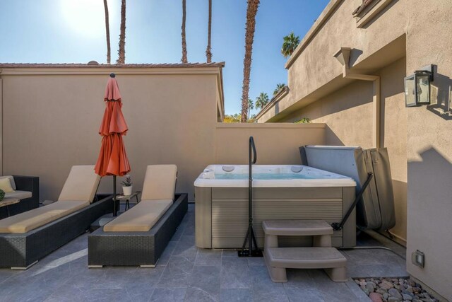 view of patio / terrace featuring a hot tub