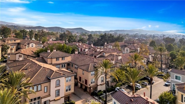 drone / aerial view with a residential view and a mountain view