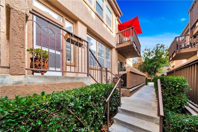 doorway to property with stucco siding