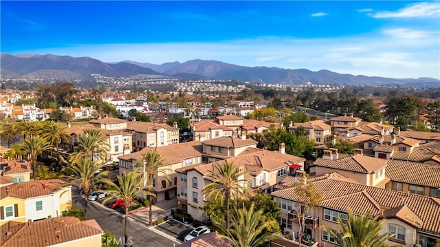 drone / aerial view featuring a residential view and a mountain view