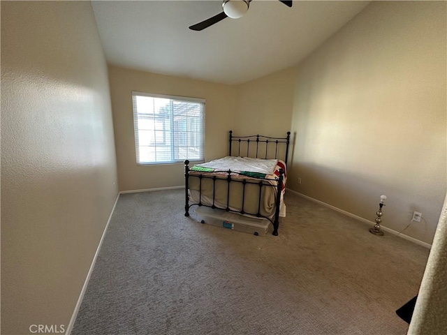 bedroom featuring lofted ceiling, carpet flooring, a ceiling fan, and baseboards