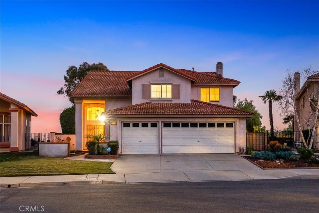 view of front of property with a garage