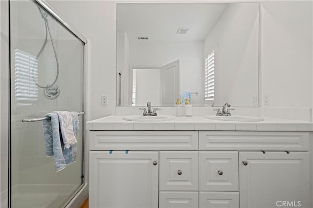 bathroom featuring vanity and walk in shower