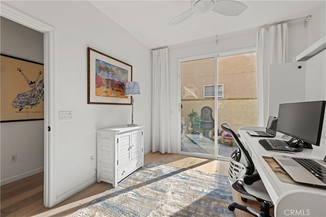 office space with ceiling fan, lofted ceiling, and light hardwood / wood-style floors