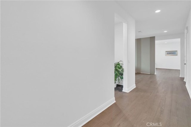 hall with light hardwood / wood-style flooring