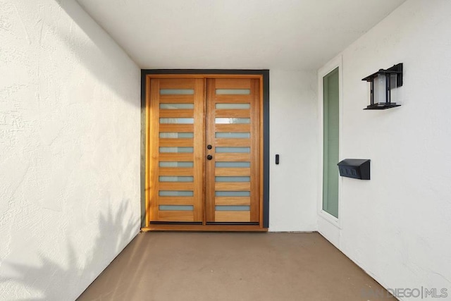 doorway to property featuring french doors