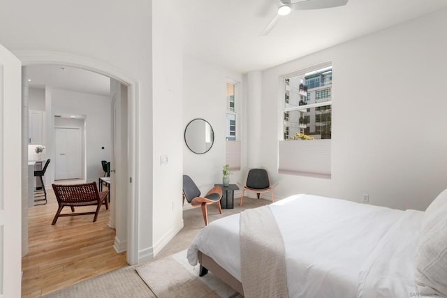 bedroom with hardwood / wood-style flooring and ceiling fan