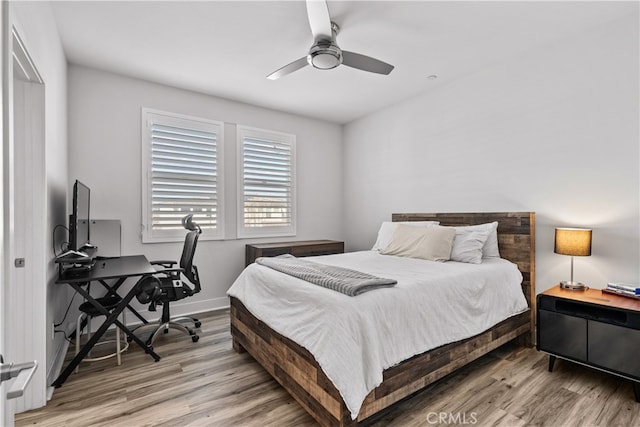 bedroom featuring ceiling fan and wood-type flooring