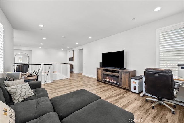 living room with light hardwood / wood-style flooring