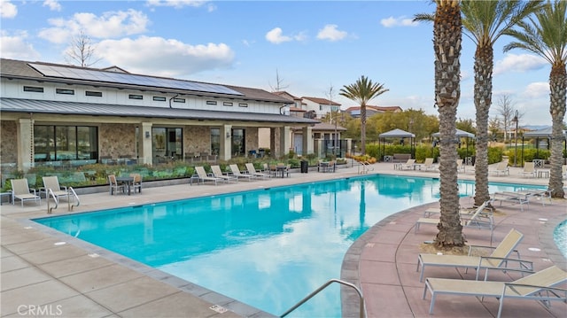 view of pool featuring a patio