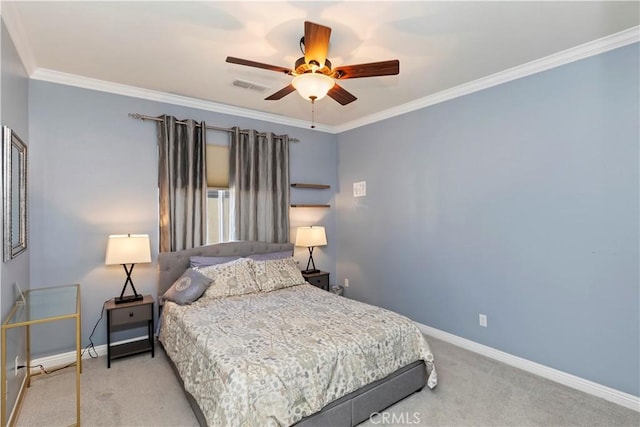 carpeted bedroom featuring crown molding and ceiling fan