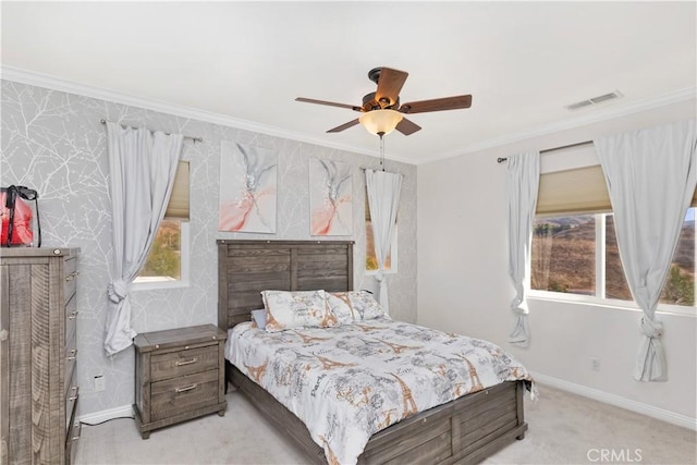 bedroom with multiple windows, crown molding, light carpet, and ceiling fan