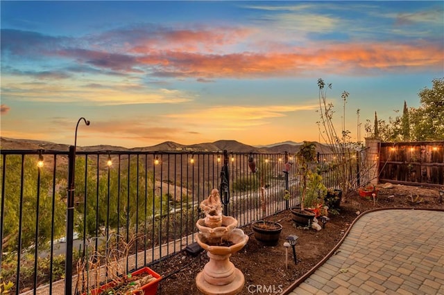 patio terrace at dusk with a mountain view