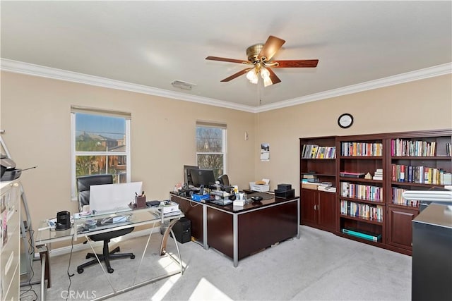 home office with crown molding, light colored carpet, and ceiling fan