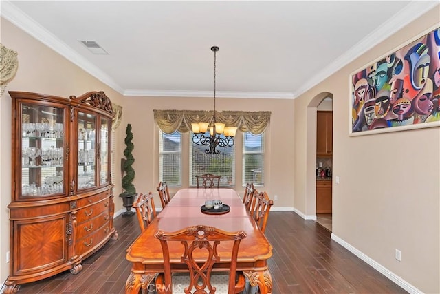 dining area with ornamental molding, dark hardwood / wood-style flooring, and a notable chandelier