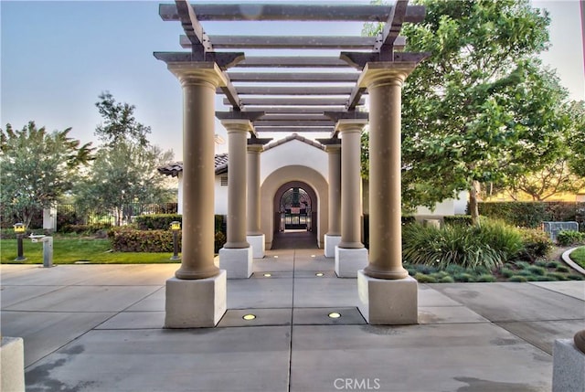 view of home's community with a pergola and a patio area