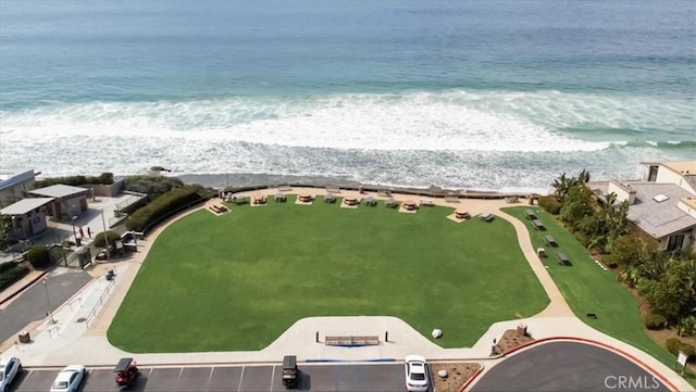 drone / aerial view with a beach view and a water view