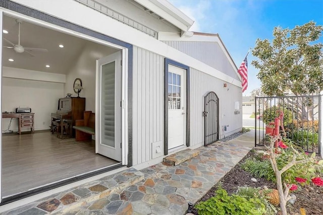 doorway to property with ceiling fan