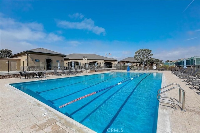 view of pool featuring a patio