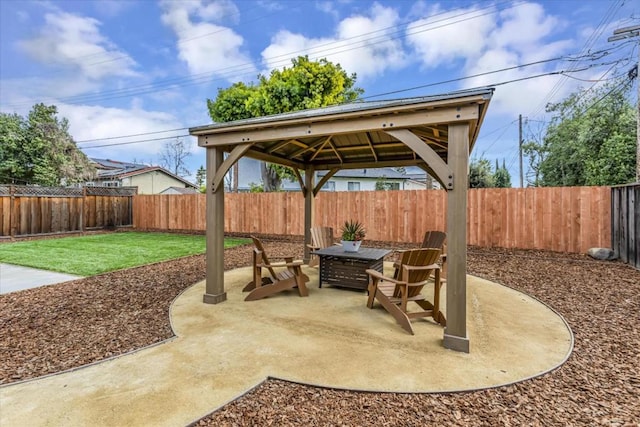 view of patio featuring a gazebo and an outdoor fire pit