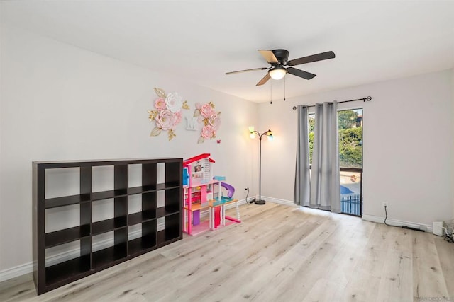 recreation room featuring ceiling fan and light wood-type flooring