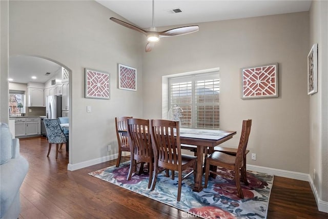 dining area with ceiling fan and hardwood / wood-style floors