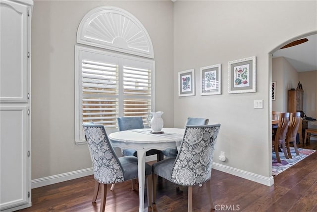 dining area with dark wood-type flooring