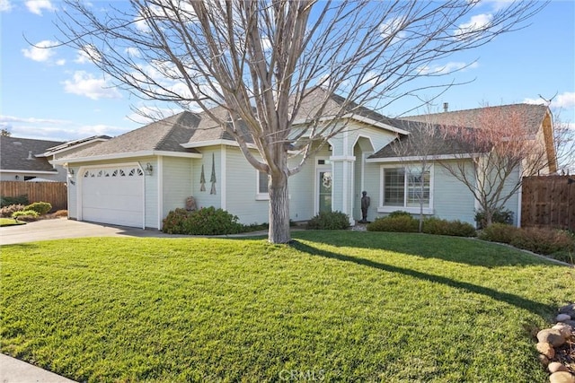 ranch-style house featuring a garage and a front yard