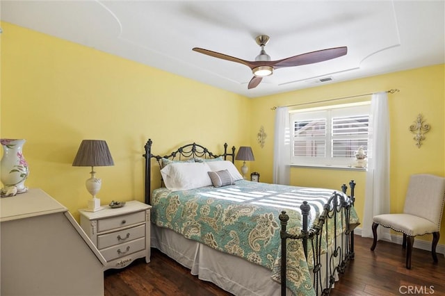 bedroom with ceiling fan and dark wood-type flooring