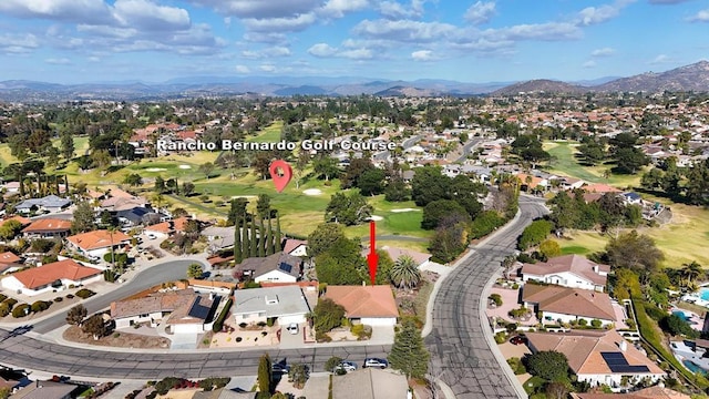 birds eye view of property with a mountain view