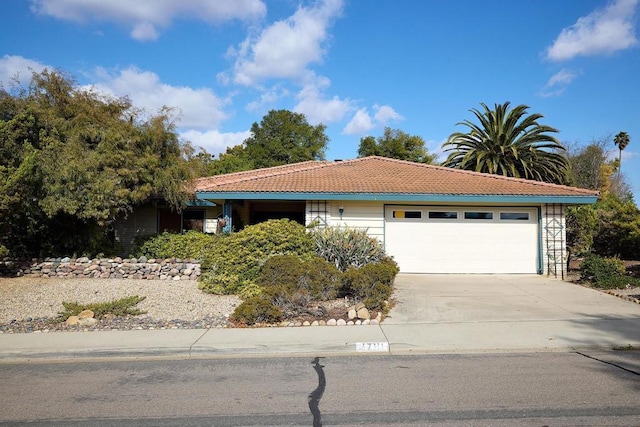 single story home featuring a garage