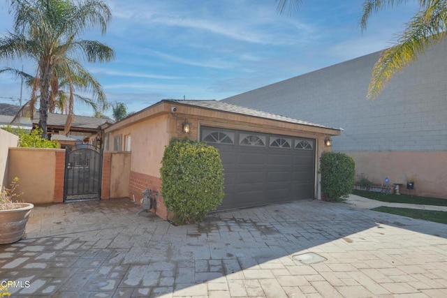 view of side of property with a garage