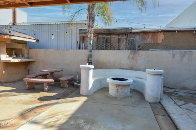 view of patio featuring a fire pit