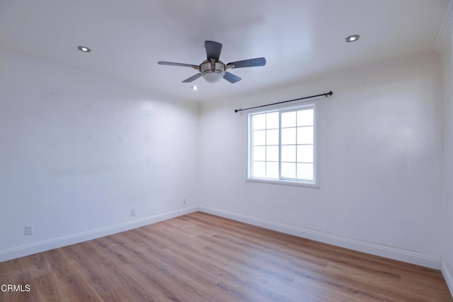 unfurnished room featuring crown molding, ceiling fan, and light hardwood / wood-style floors