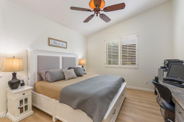 bedroom featuring ceiling fan, vaulted ceiling, and light hardwood / wood-style flooring