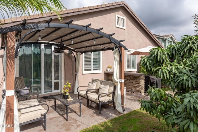 view of patio featuring outdoor lounge area and a pergola