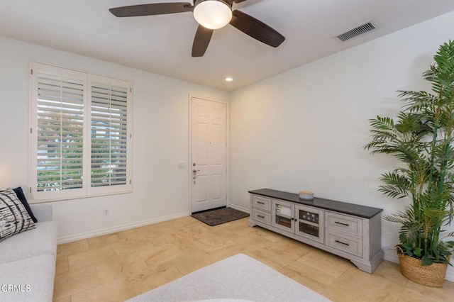 foyer with ceiling fan