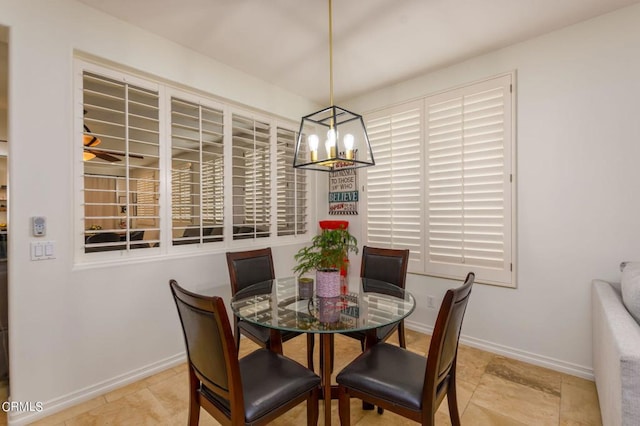 dining room featuring a notable chandelier