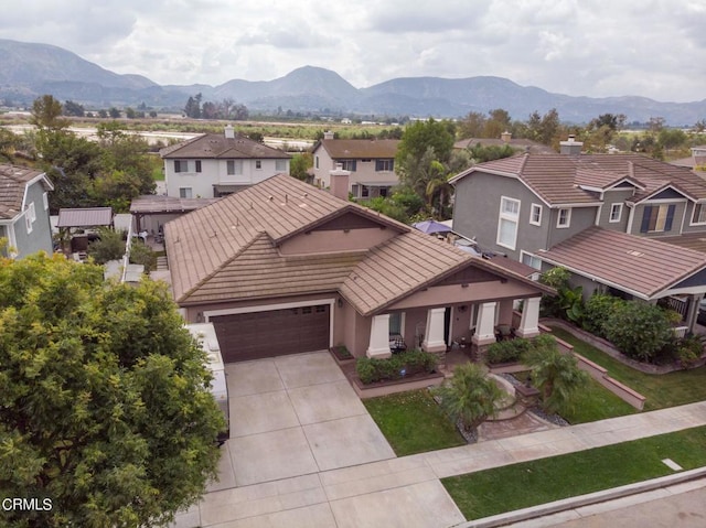 exterior space with a mountain view and a garage