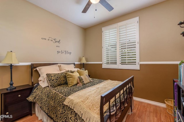 bedroom featuring ceiling fan and light hardwood / wood-style flooring