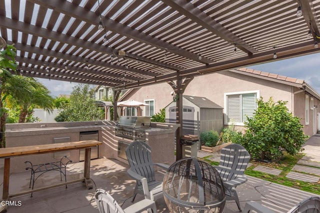 view of patio with an outdoor kitchen, grilling area, and a pergola