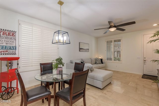 dining space featuring ceiling fan