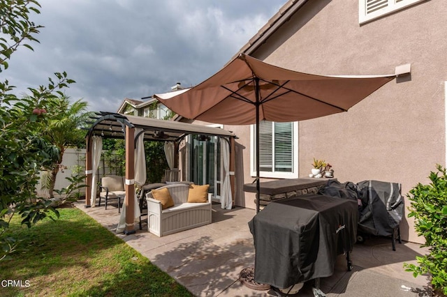 view of patio / terrace with a grill and a gazebo