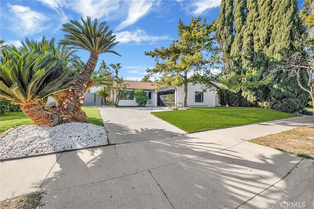 obstructed view of property with a front yard