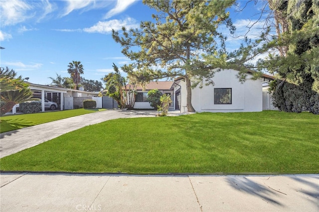 ranch-style home with a front yard