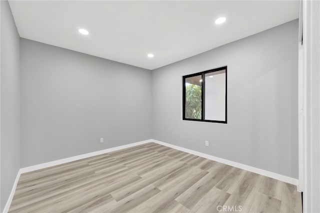 unfurnished room featuring light wood-type flooring