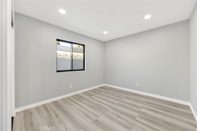 unfurnished room featuring light hardwood / wood-style flooring