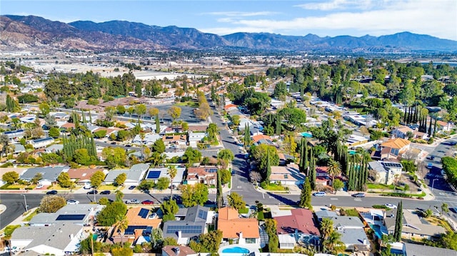 birds eye view of property with a mountain view