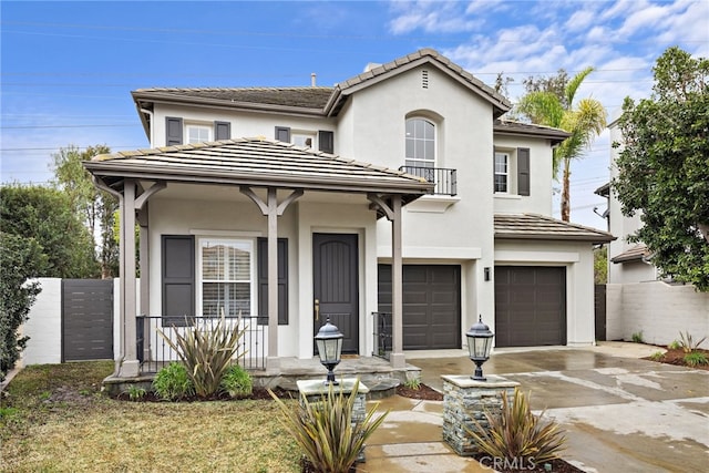 view of front of house featuring a garage and covered porch